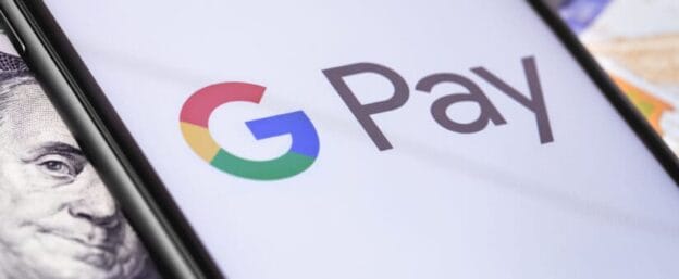 money dollars and smartphone with google pay logo on the screen 142599037 825x340 1
