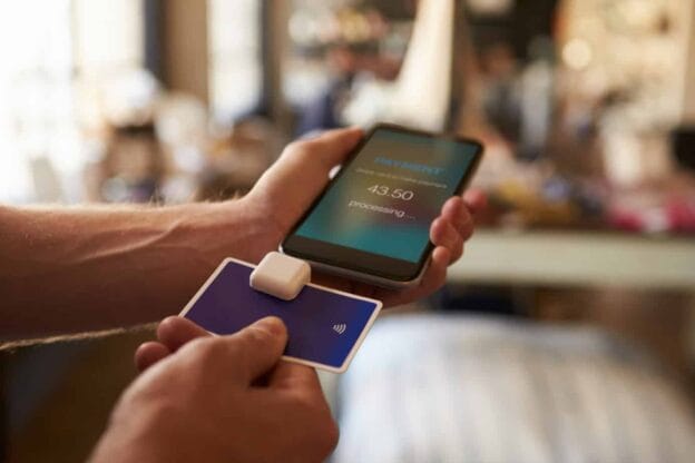 credit card payment app attached to mobile phone 67534402
