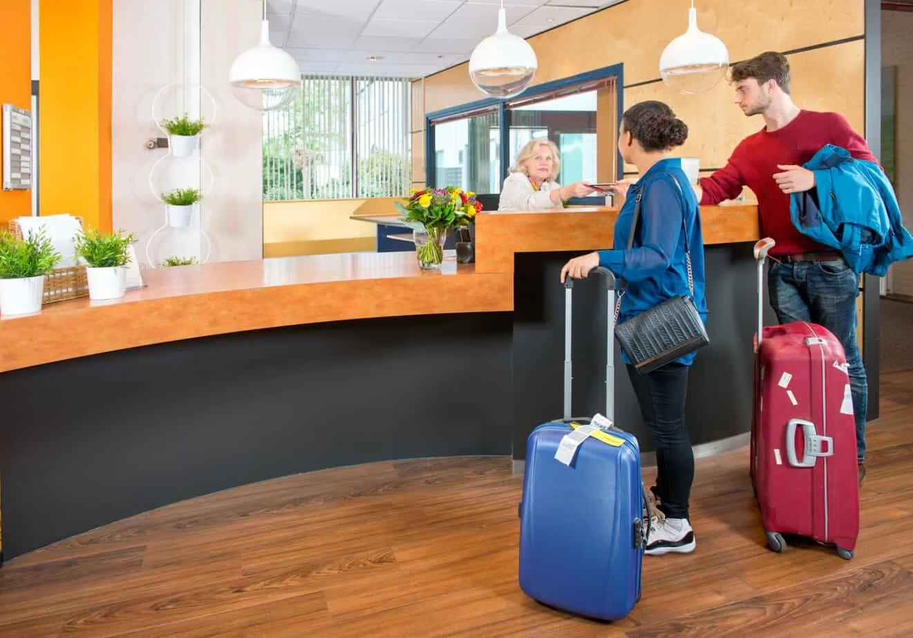 young travelers at hotel check in 55859111 how to welcome guests