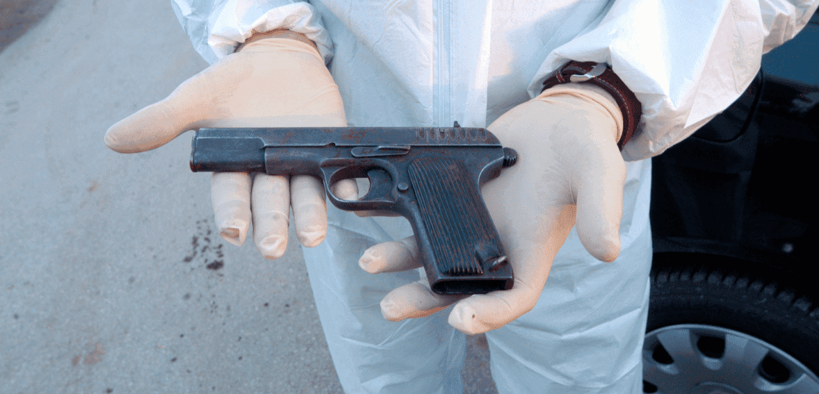 man holding a gun Things To Remember Before Getting An FFL License