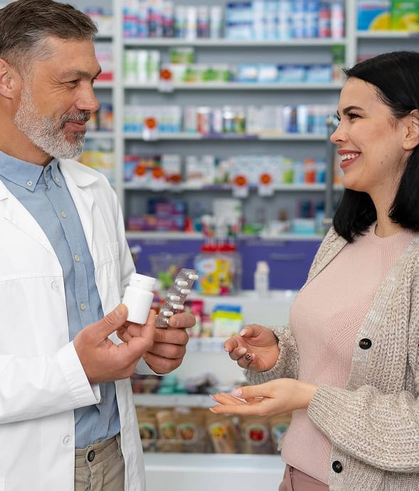 Wide pharmacy transaction with pharmacist helping customer, payment processing, healthcare and retail support.
