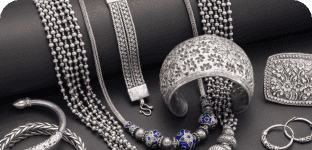 Elegant jewelry display featuring necklaces, bracelets, and rings with premium gemstone accents.