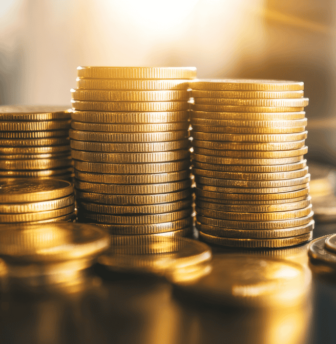 Stacks of gold coins representing payment processing and merchant services from Host Merchant Services.