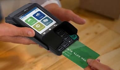 Mobile point-of-sale payment terminal processing credit card payments.