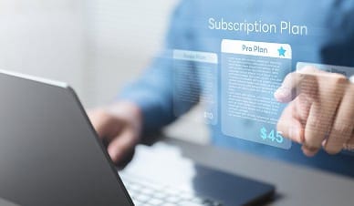 Secure online subscription payment interface with a computer and digital plan options.
