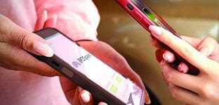 Mobile payment transaction using smartphones tied to Host Merchant Services.