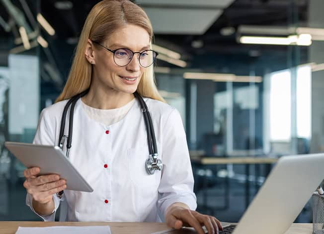 Doctors using online tools for patient care and credit card processing.