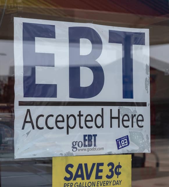 EBT accepted here sign at convenience store, promoting healthy food access, SNAP benefits.