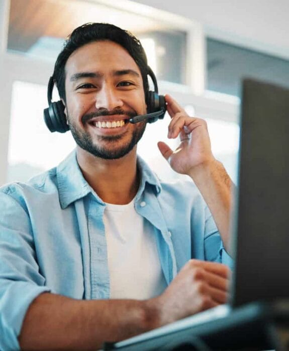 Reliable customer support agent with headset at modern office.