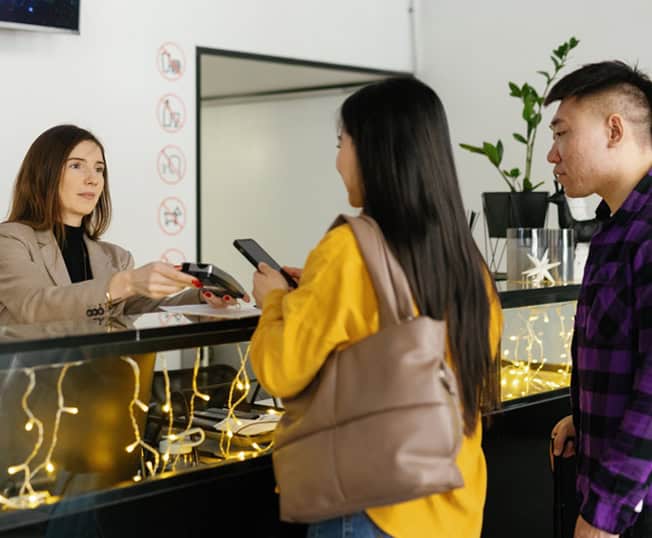 Contactless payment transaction at a retail store with portable card reader, POS technology, small business cashless payment solution, credit card setup, in-store customer service.
