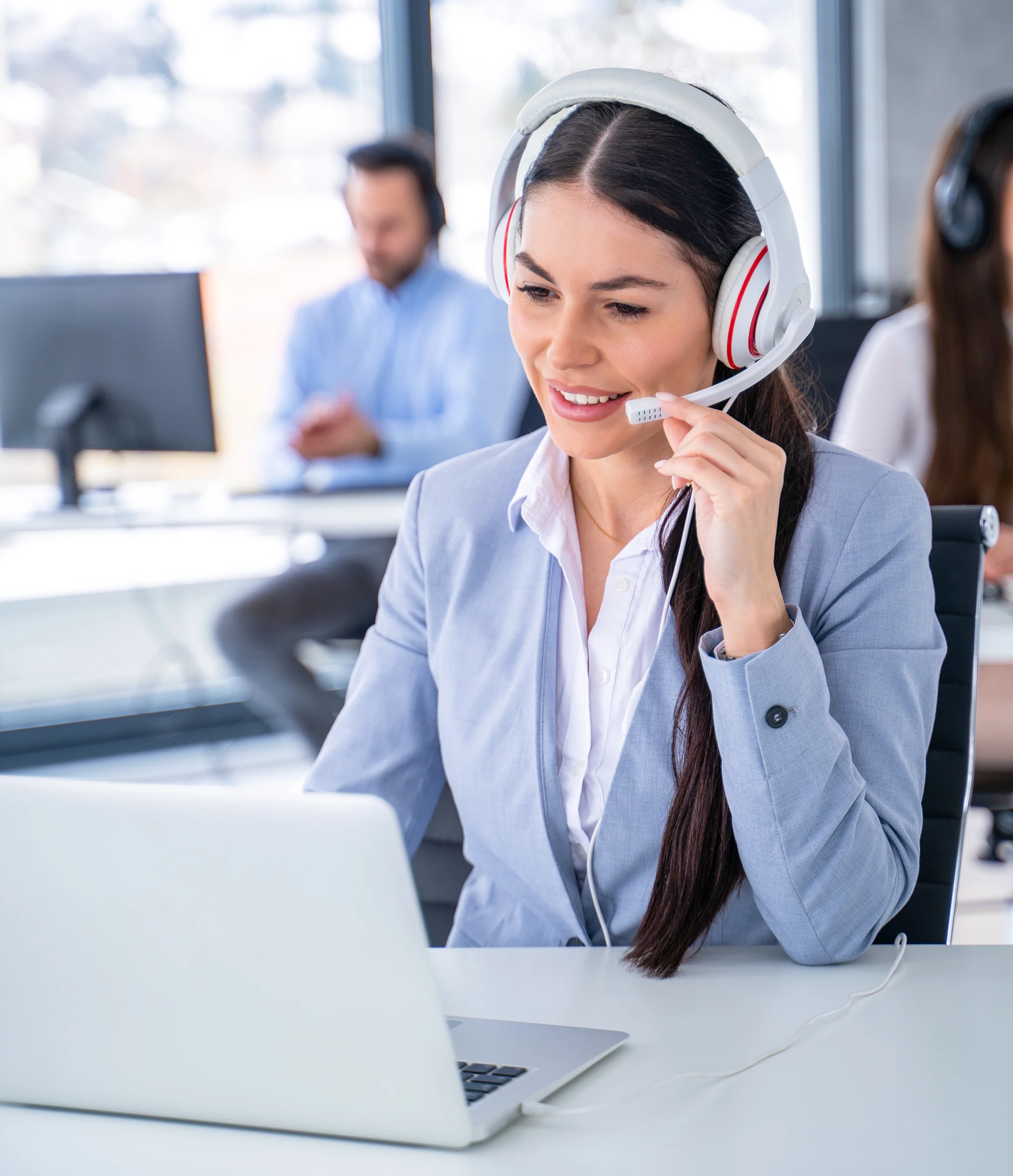 Customer support representative wearing a headset assisting with Valor RCKT Mobile POS questions