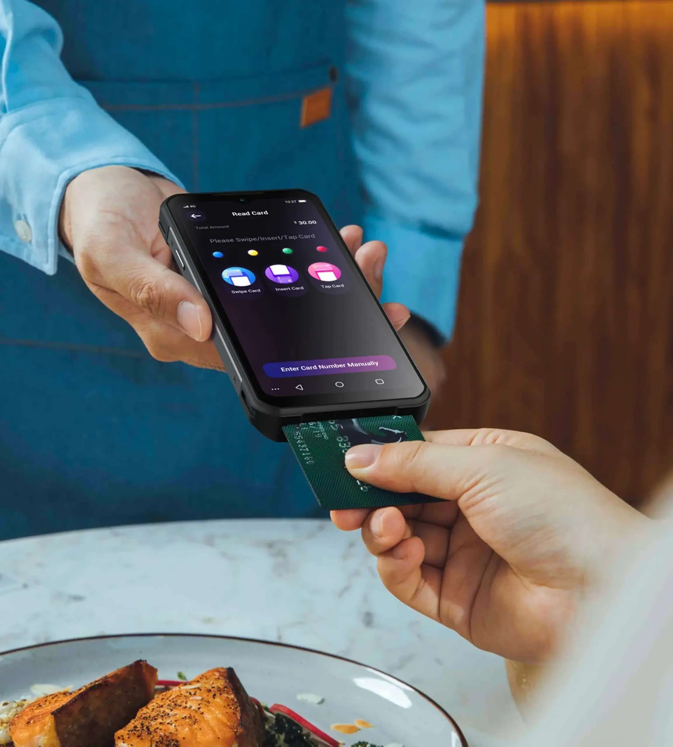 PAX A6650 handheld SmartPOS terminal processing an EMV chip card payment in a restaurant