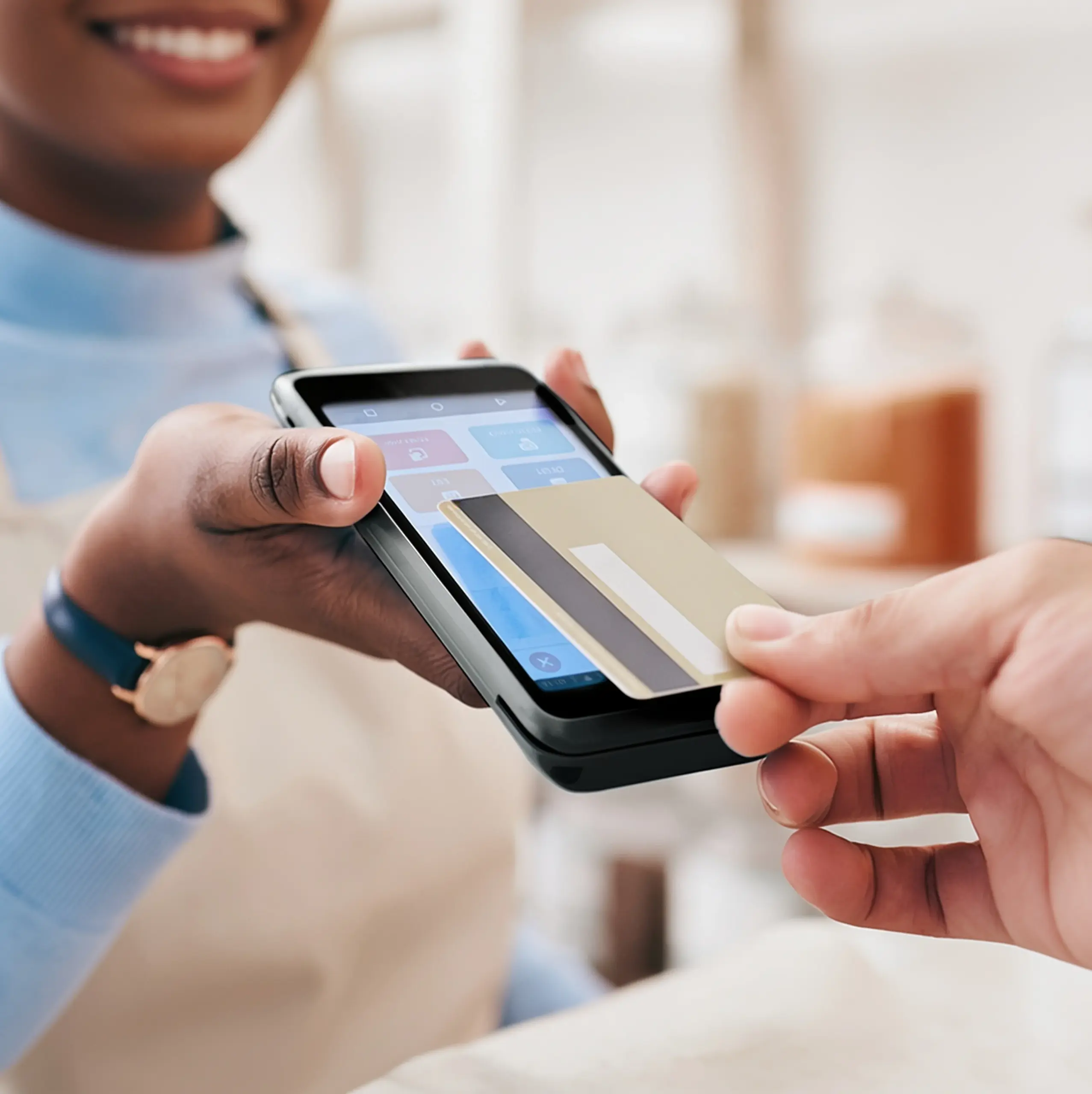Customer presenting a payment card to a Dejavoo P5 terminal for secure in-person payment processing