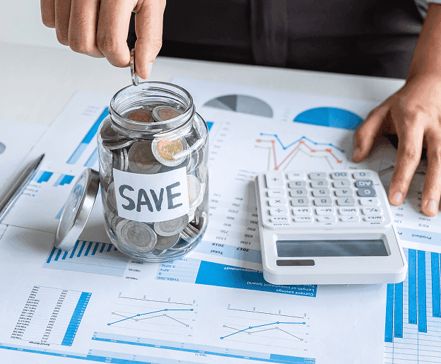 Coins in a jar labeled "SAVE" with financial charts and a calculator, illustrating payment processing and savings solutions.