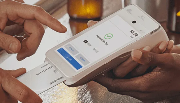 Contactless payment transaction at Host Merchant Services with modern POS system.