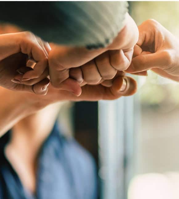 Supportive hand gesture representing trusted payment solutions at Host Merchant Services.
