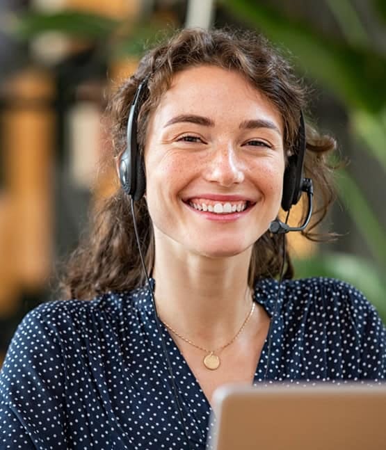 Friendly customer support representative with headset providing payment solutions at Host Merchant Services.
