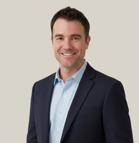 Modern professional man in suit smiling, representing Host Merchant Services payment solutions.