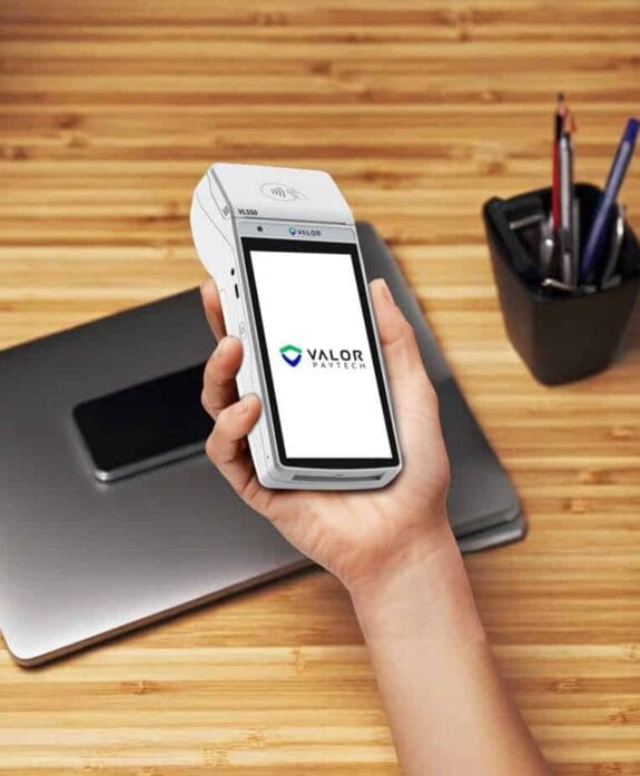 Mobile payment device with Valor PayTech logo for Host Merchant Services.