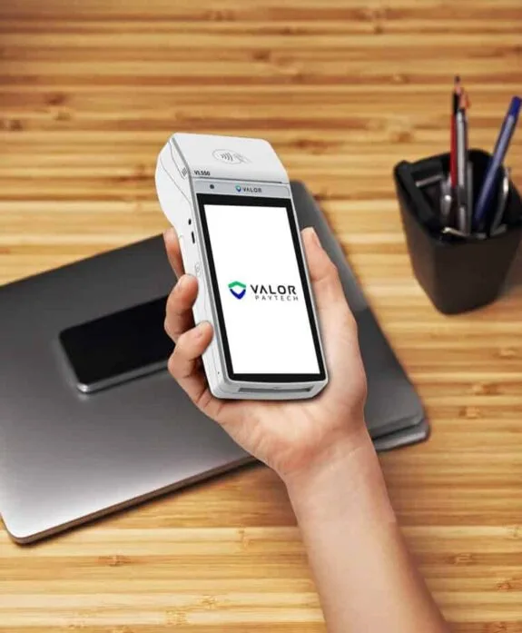 Mobile payment device with Valor PayTech logo for Host Merchant Services.