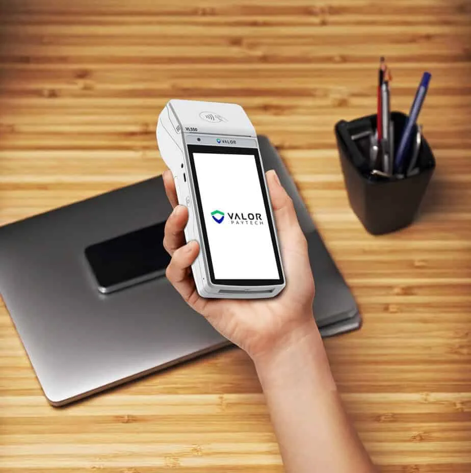 Mobile payment device with Valor PayTech logo for Host Merchant Services.