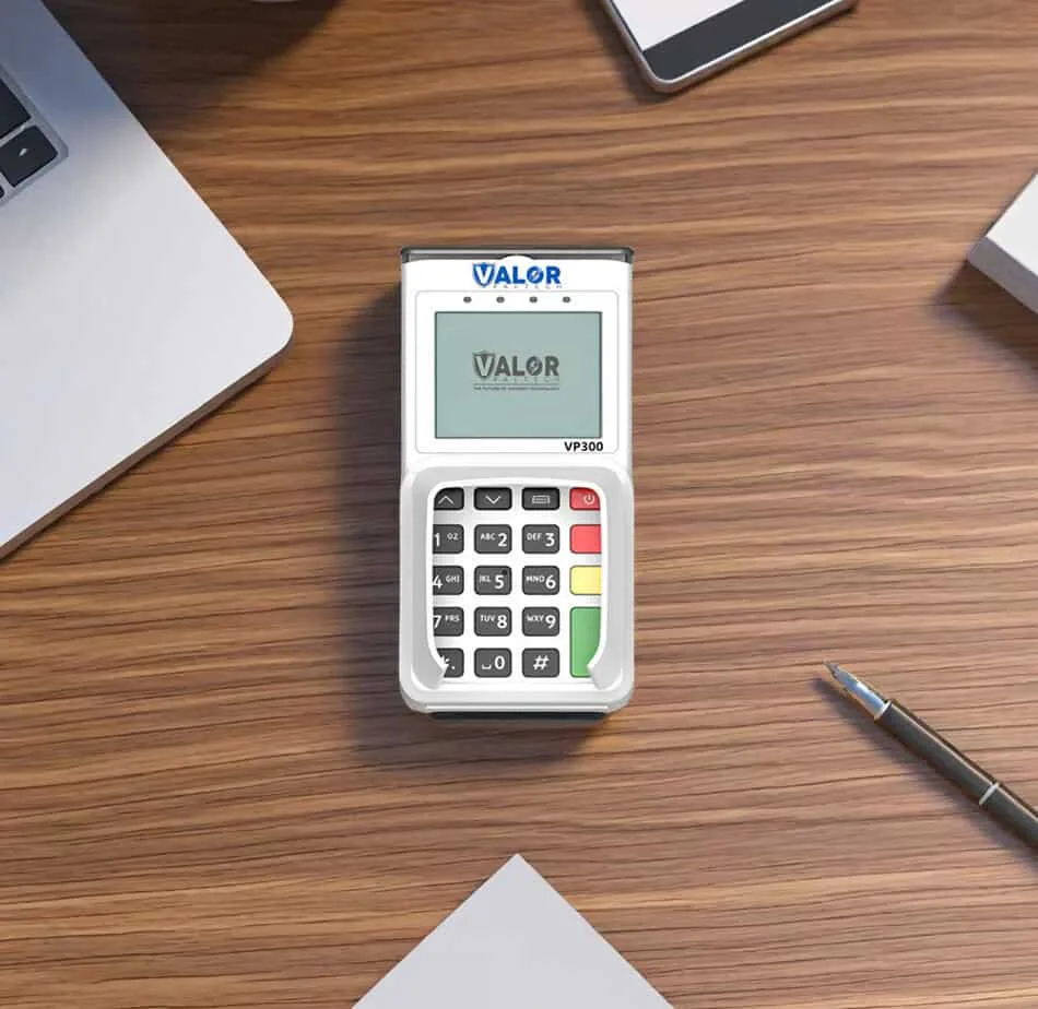 Portable payment terminal for Host Merchant Services on wooden desk.