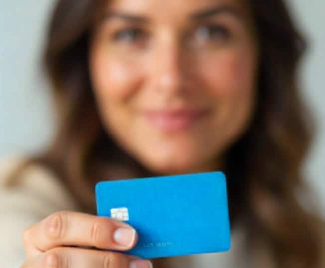 Contactless payment with a blue credit card, focus on Host Merchant Services.