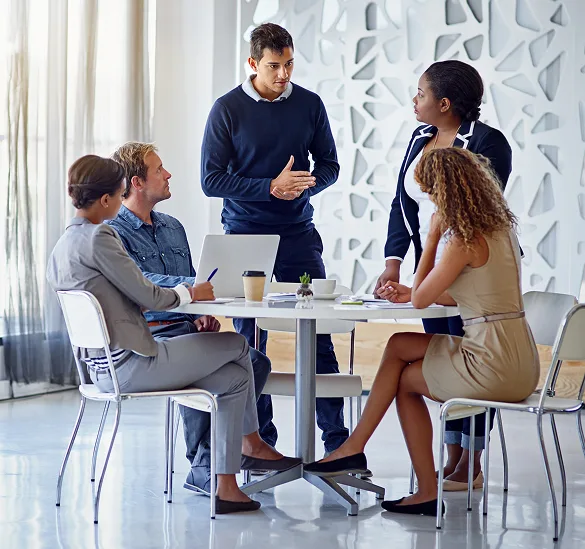 Effective team meeting at Host Merchant Services office for business payment solutions.