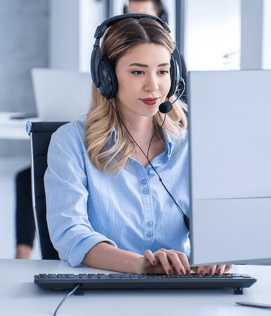 Customer service representative with headset at laptop, providing payment processing support for Host Merchant Services.