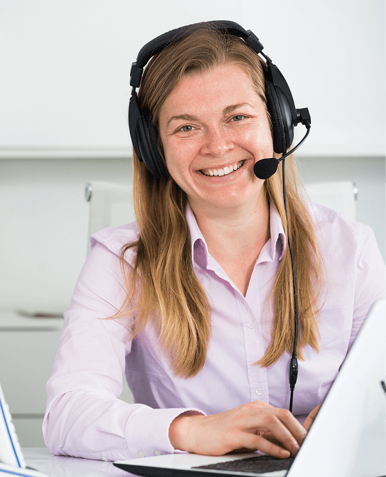 Exceptional customer support representative with headset and friendly smile at workspace.