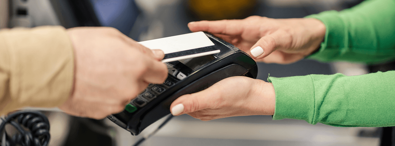 POS credit card payment transaction at restaurant, customer paying bill, friendly service.