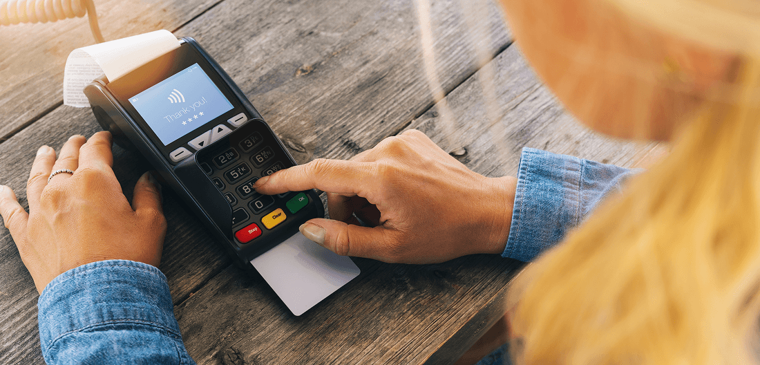 Secure credit card payment being processed at a retail checkout.