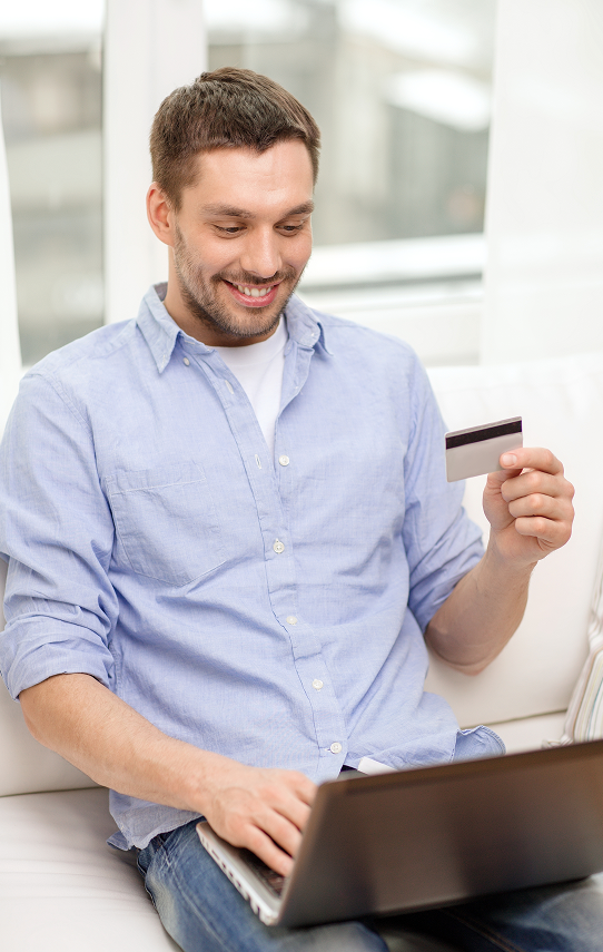 Contactless payment with a credit card and smartphone at a modern retail checkout.