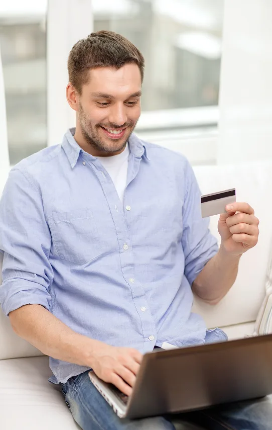 Contactless payment with a credit card and smartphone at a modern retail checkout.