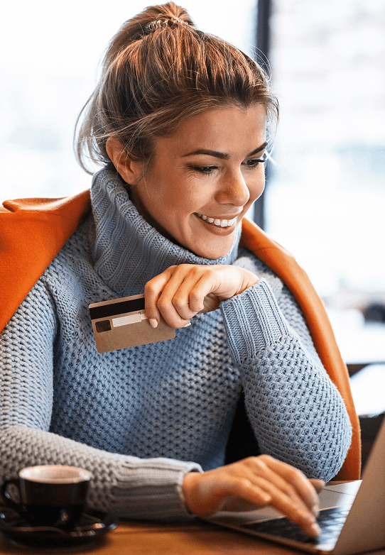 Contactless payment with a credit card and smartphone at a modern retail checkout.