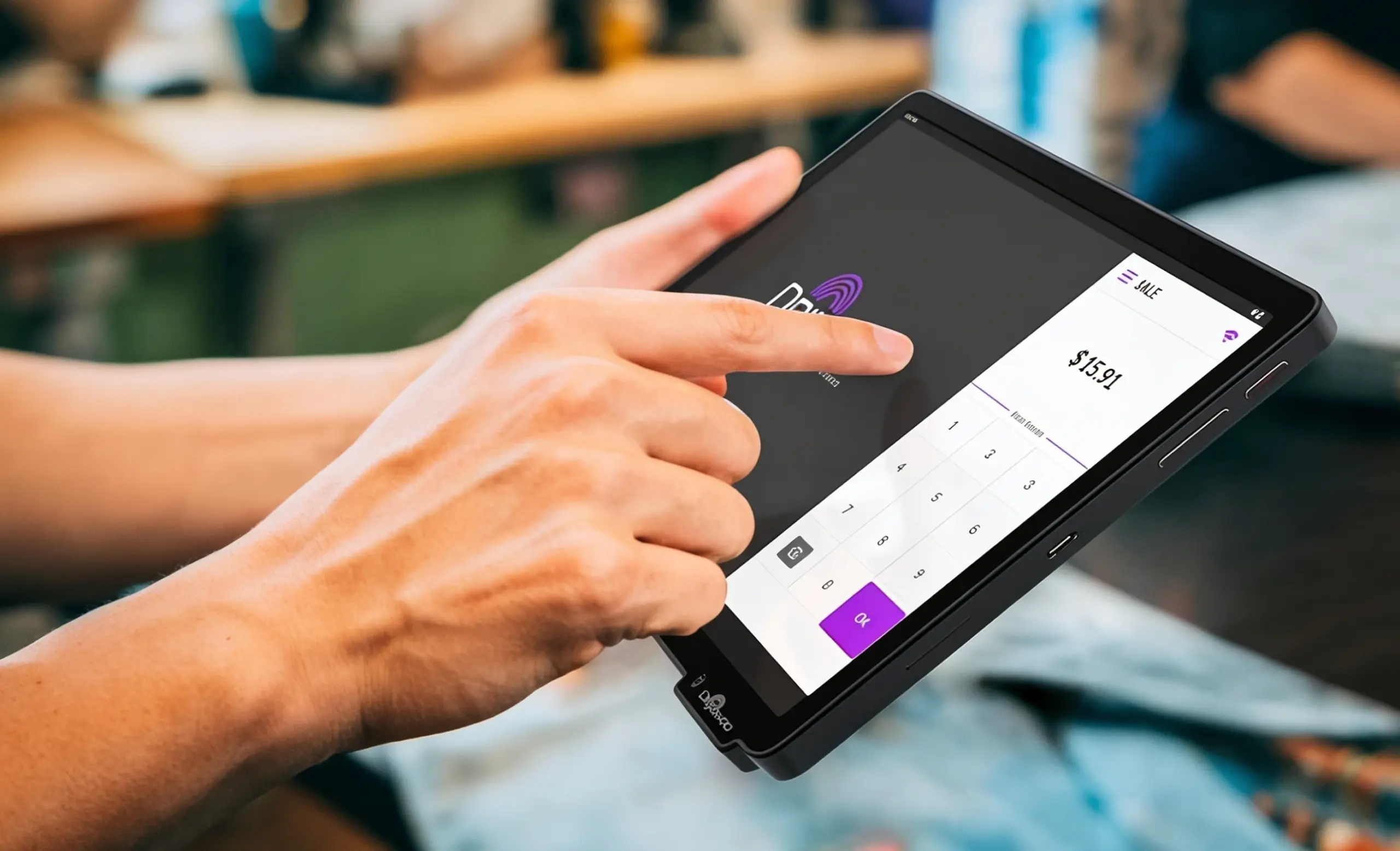 Hand using a Dejavoo P18 wireless POS terminal in mobile mode for on-the-go payment processing