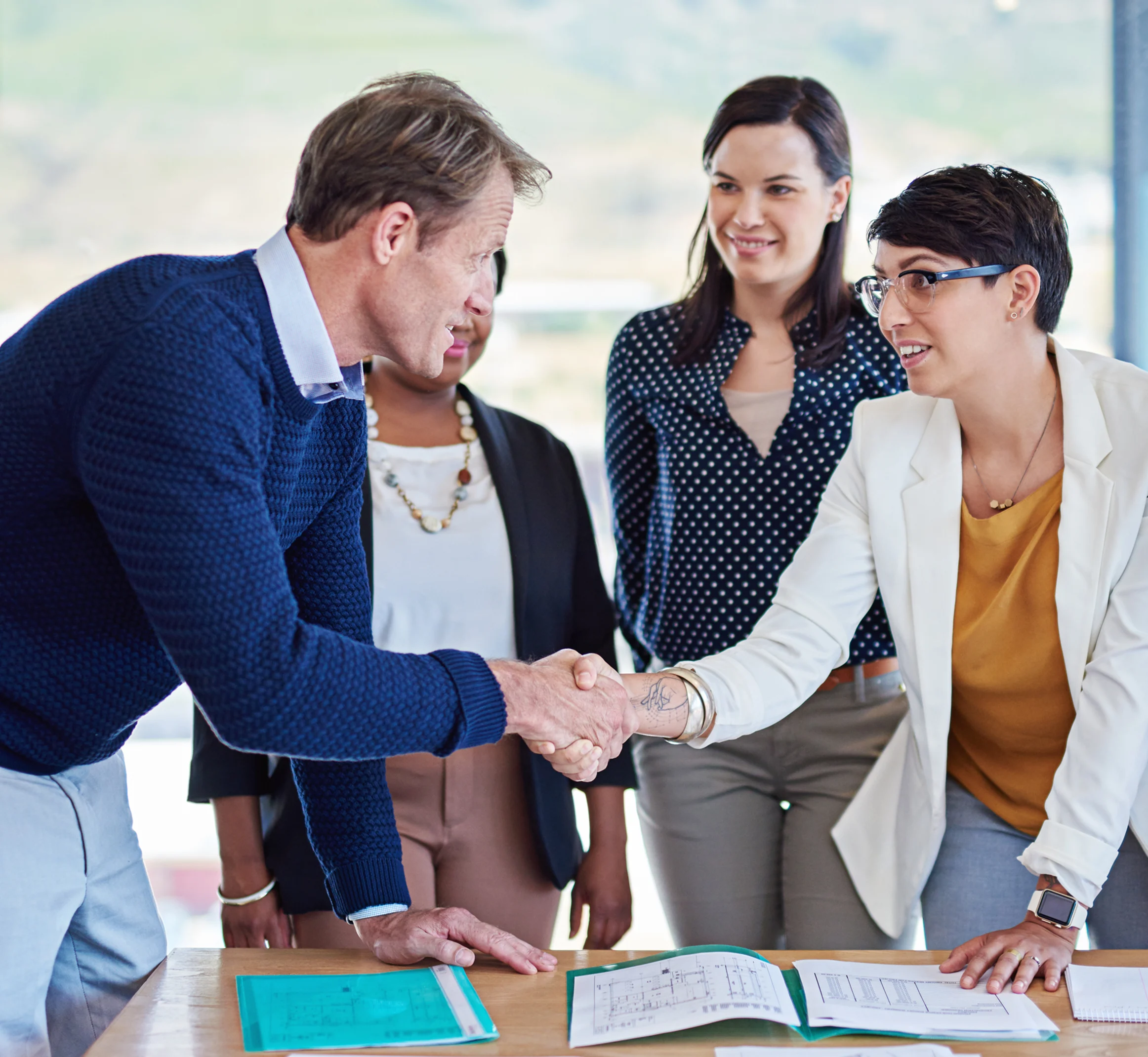 Business professionals discussing recurring billing and high-value payment workflows during a client meeting