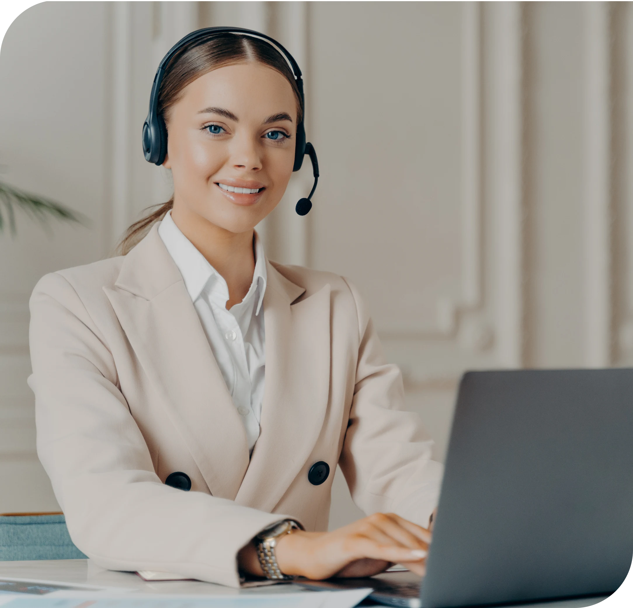 Customer support representative wearing a headset assisting with real estate payment and property management questions