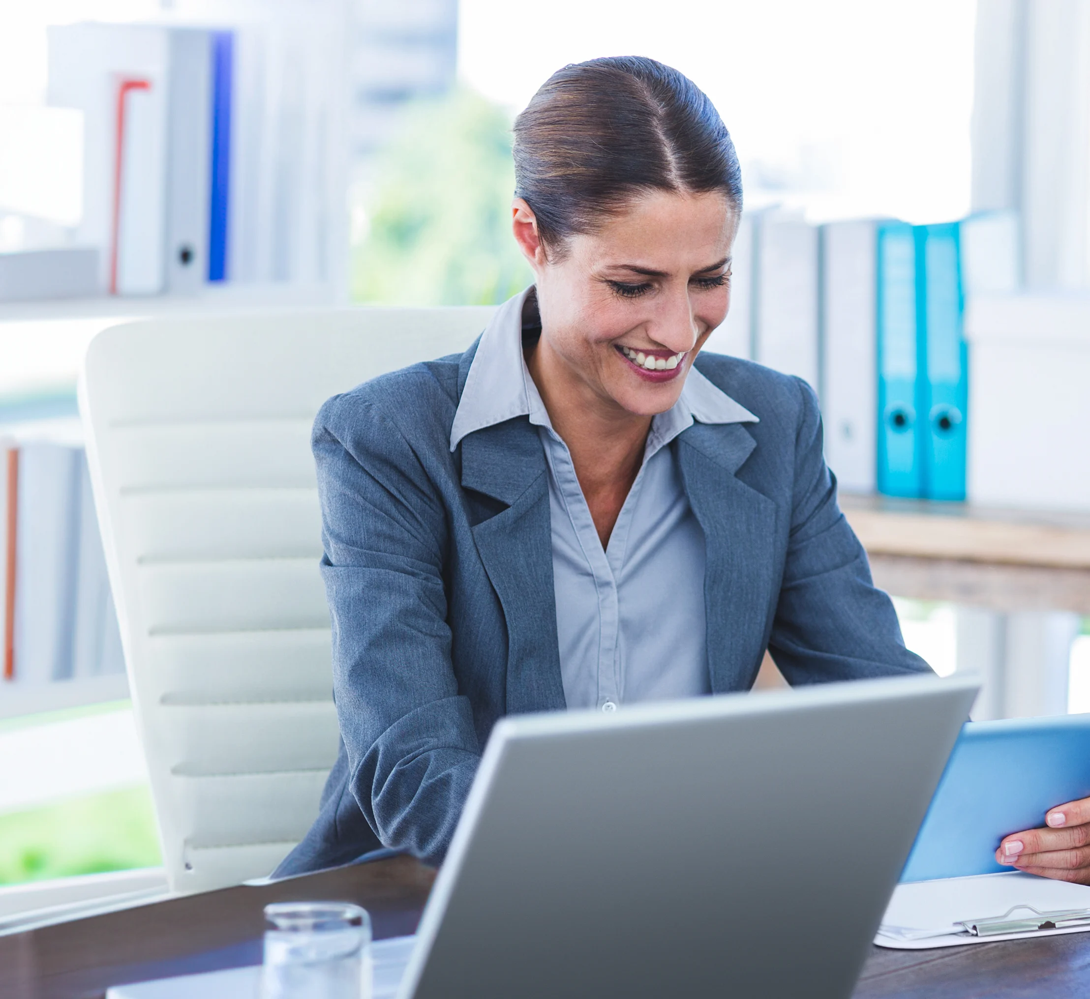 Business professional using a laptop for digital bank payments, invoicing, and accounts receivable