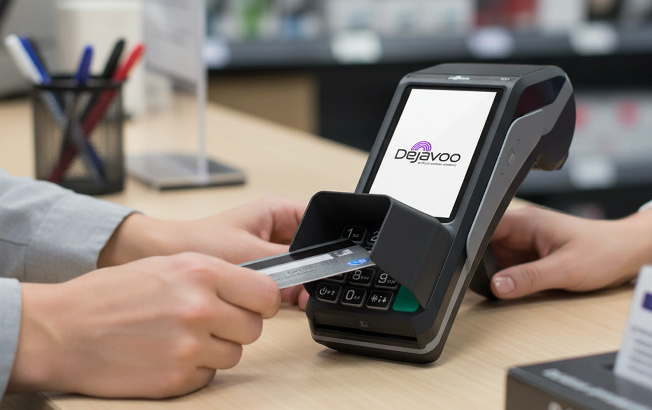 Customer inserting a payment card into a Dejavoo credit card terminal for secure in-person payment processing